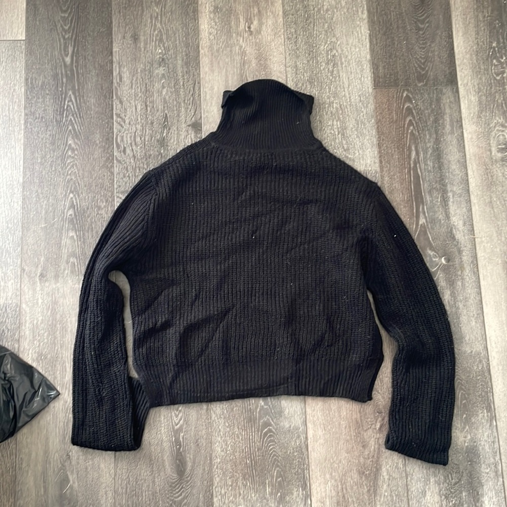 Black knitted turtleneck sweater